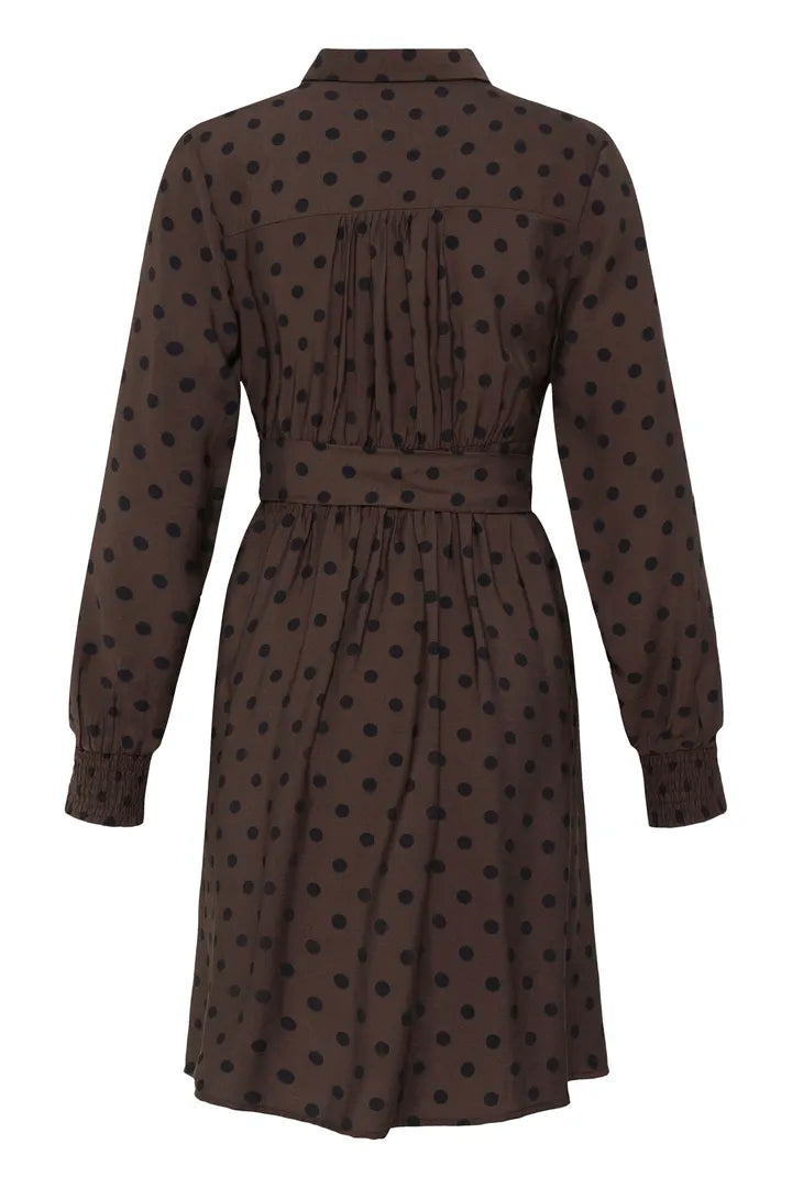 A dark brown long-sleeve shirt dress with black polka dots, shown from the back against a plain white background.
