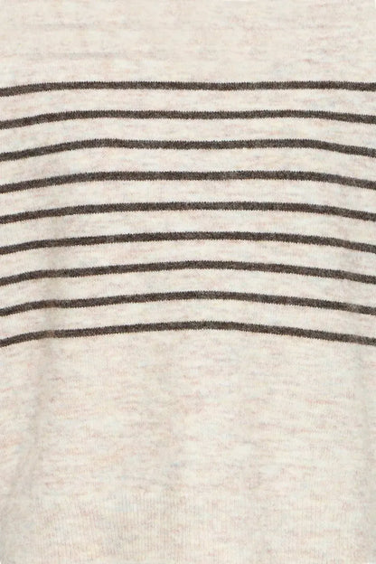 Close-up of a knit fabric with horizontal dark brown stripes on a light beige or off-white background.